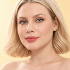 Model wearing Oplenza Signature Longwear Matte Lipstick in 03 Almande, showing nude pink-peach matte lips.