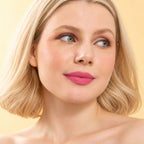 Model wearing Oplenza Signature Longwear Matte Lipstick in 05 Rosette, showing pink matte lips.