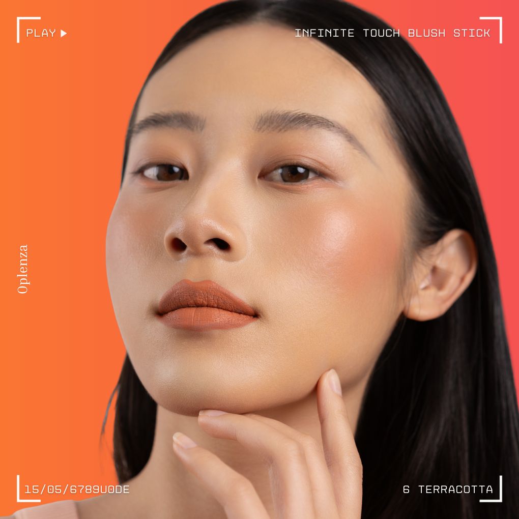 A woman wearing on her cheek Oplenza highly pigmented, bold color dewy Blush Stick in shade 06 Terracotta