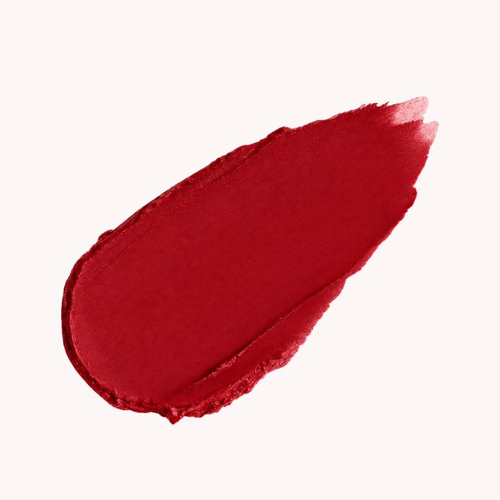 Red matte lipstick swatch in 12 Bordeaux by Oplenza, showing the colour and texture.