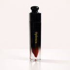 Oplenza Signature Longwear Matte Lipstick in 12 Bordeaux, a red liquid lipstick in a black and clear tube.