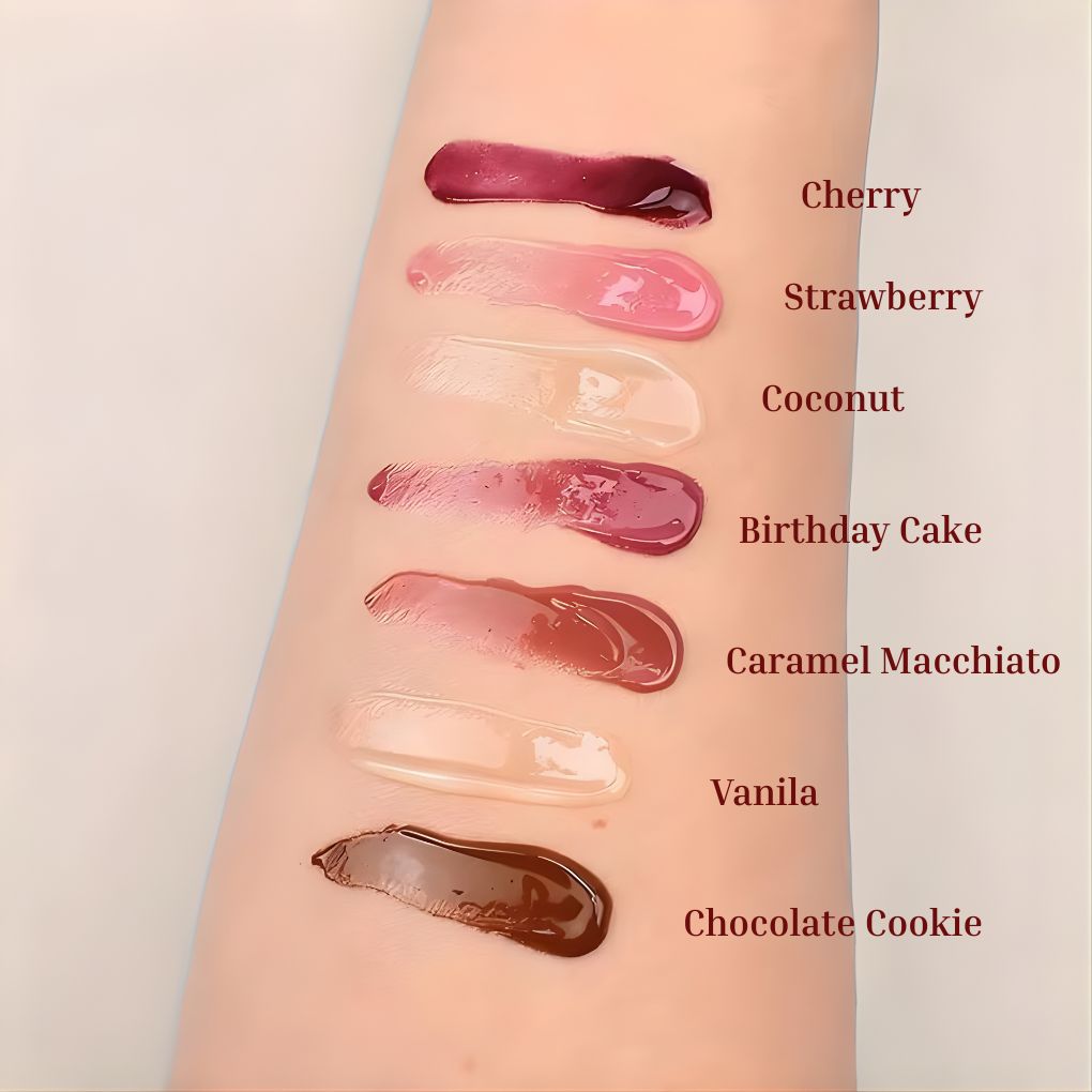 Oplenza Obsession Glass Lip Gloss full shade range.
Shades:  Cherry, Strawberry, Coconut, Birthday Cake, Caramel Macchiato, Vanilla, Chocolate cookie.
