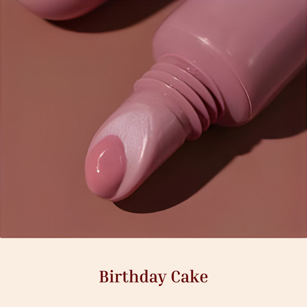 Oplenza Obsession Glass Lip Gloss applicator close-up, shade Birthday Cake