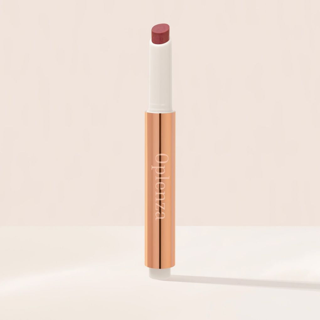 Oplenza Hydrating Shimmer Lip Balm in Bombshell, tinted moisturizing lip balm.