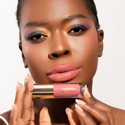 Model wearing and showcasing the vegan, cruelty-free Oplenza matte liquid lipstick in the shade Charm