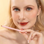 An elegant woman wearing and showcasing the vegan, luxury and cruelty free oplenza Define & Refine Lip Liner in the color 13 Cocoa Rouge