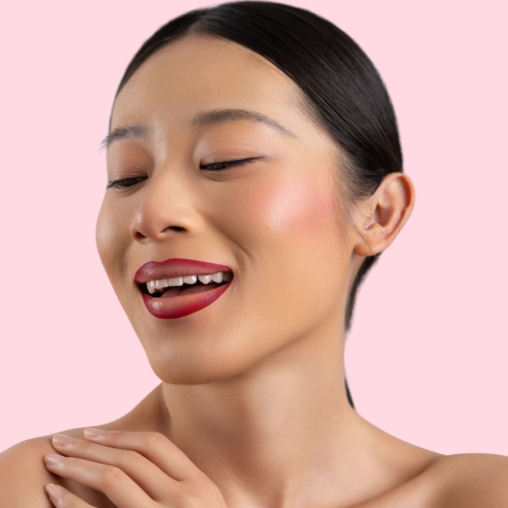 An elegant woman wearing the vegan, luxury and cruelty free oplenza Define & Refine Lip Liner in the color 27 Crimson Velvet