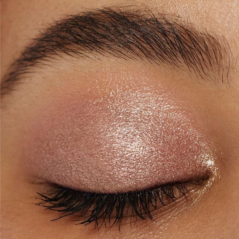 Woman showcasing Oplenza Easy Glide Eyeshadow Stick in shade Dazzling- Easy Glide Eyeshadow Stick applied on eyelid. Effortless makeup routines