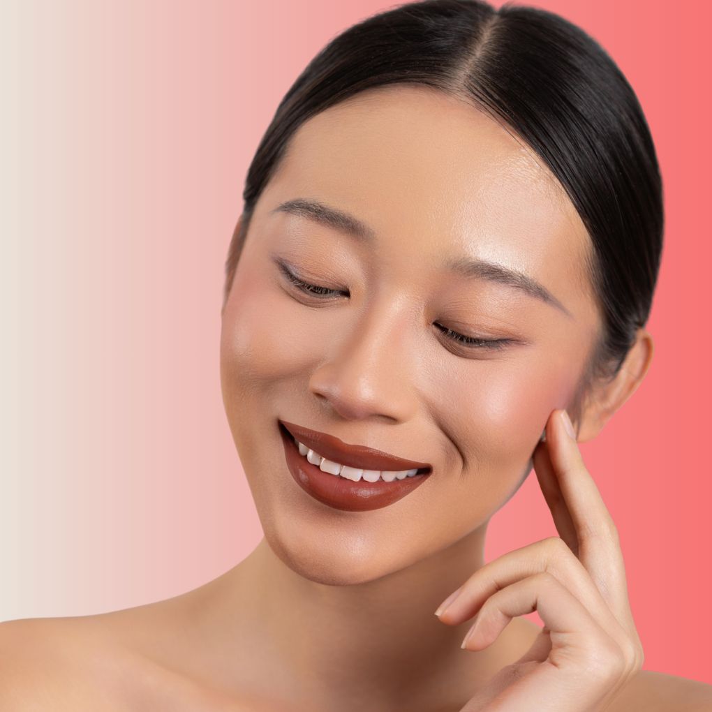 An elegant woman wearing and showcasing the vegan, luxury and cruelty free oplenza Define & Refine Lip Liner in the color 06 Deep Bark