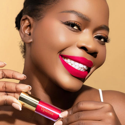 Model wearing and showcasing the vegan, cruelty-free Oplenza matte liquid lipstick in the shade Fever