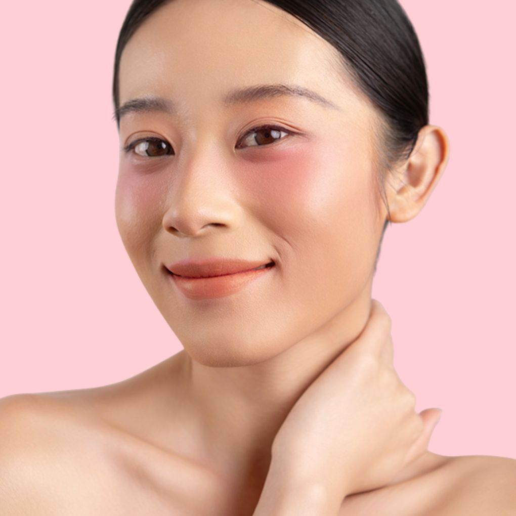 Woman wearing and showcasing the effects of the best cruelty-free Oplenza Signature Matte Lipstick in shade Kindred