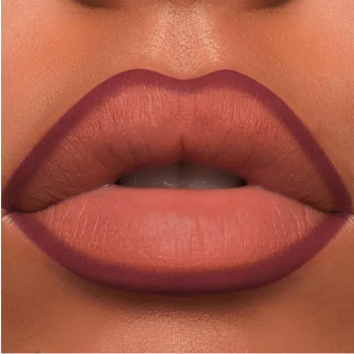 A close-up of the Oplenza Velvet Whisper Lip Liner effect on a woman's lips in the shade Bordeaux Seduction