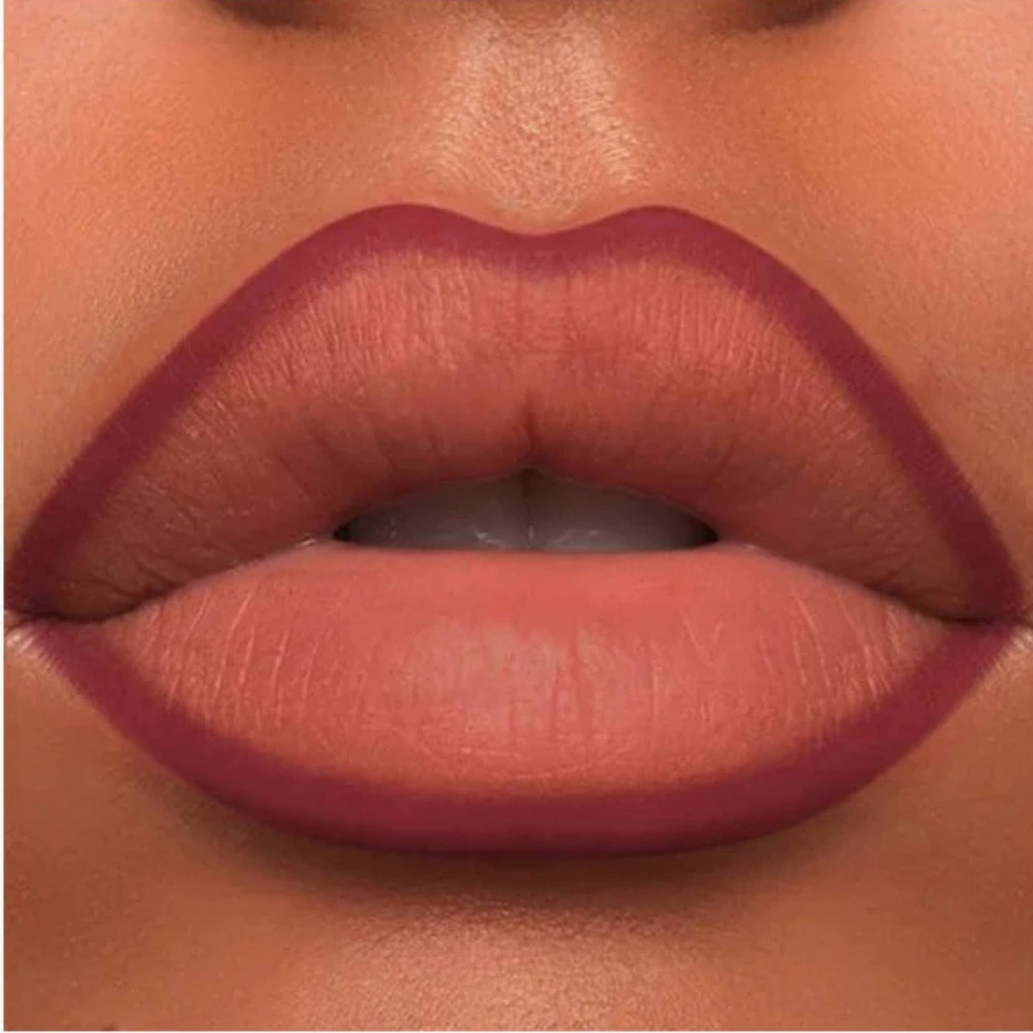 A close-up of the Oplenza Velvet Whisper Lip Liner effect on a woman's lips in the shade Scarlet Temptation