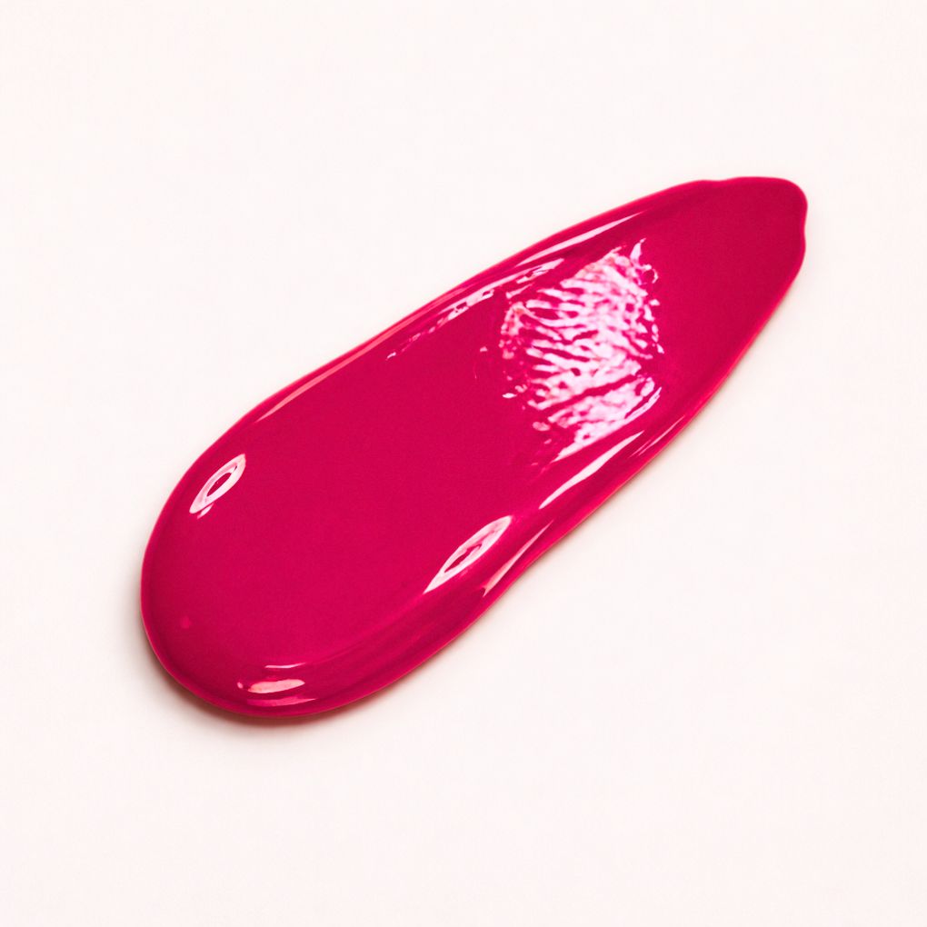 Swatch of Oplenza Signature Ultra Shine Lip Gloss in shade Luscious Red - best hydrating lip gloss.