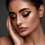 Model wearing Oplenza Perfect Strokes Liquid Eyeliner with a sharp black wing, Cotton , Brush