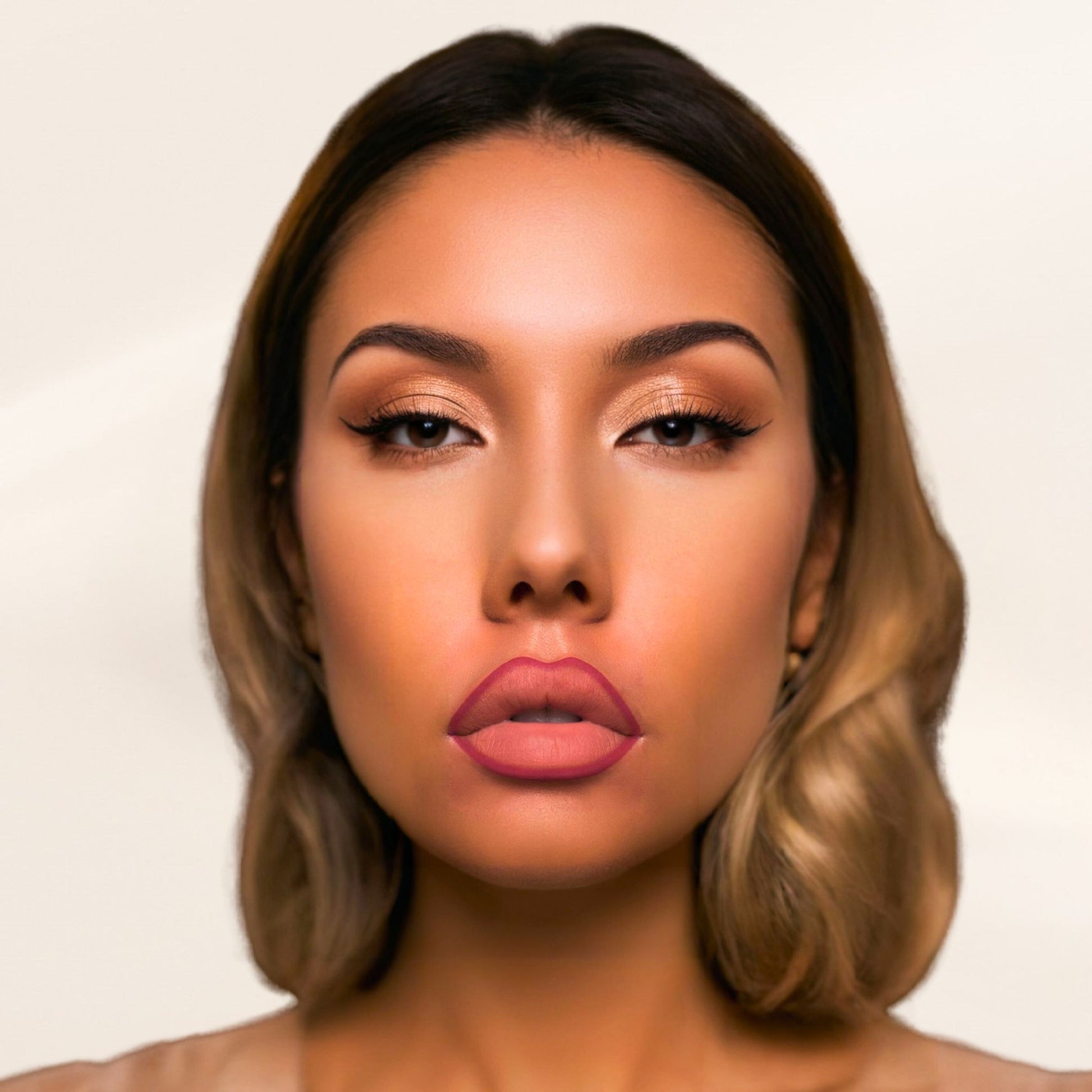 A woman wearing Oplenza Velvet Whisper Lip Liner in shade Flamingo Kiss on her lips