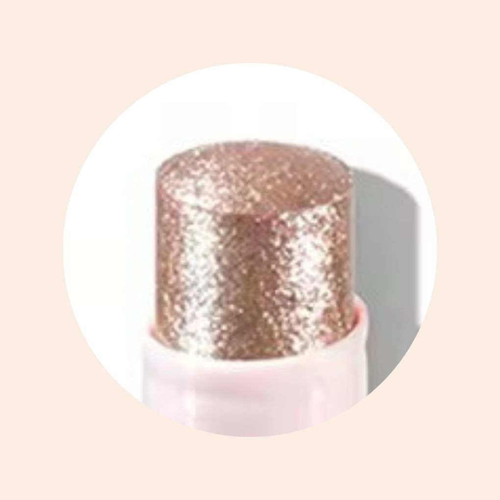 Close-up of Oplenza Crystal Jelly Glitter Stick in shade Orchid Aura-Jelly glitter highlighter on cheekbones and nose bridge