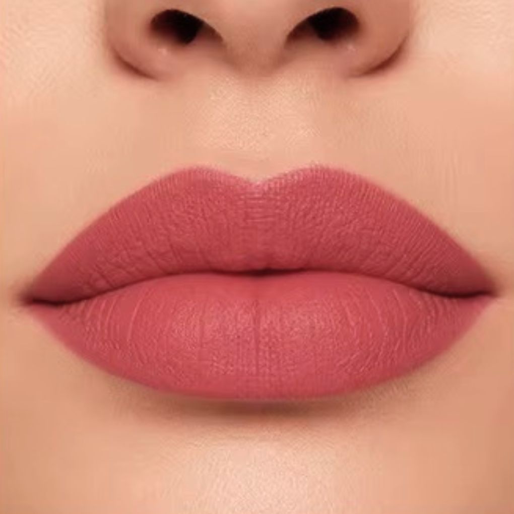 Close-up lip swatch of Oplenza Matte-to-Shine Lip Duo in Rosewood with a matte finish.