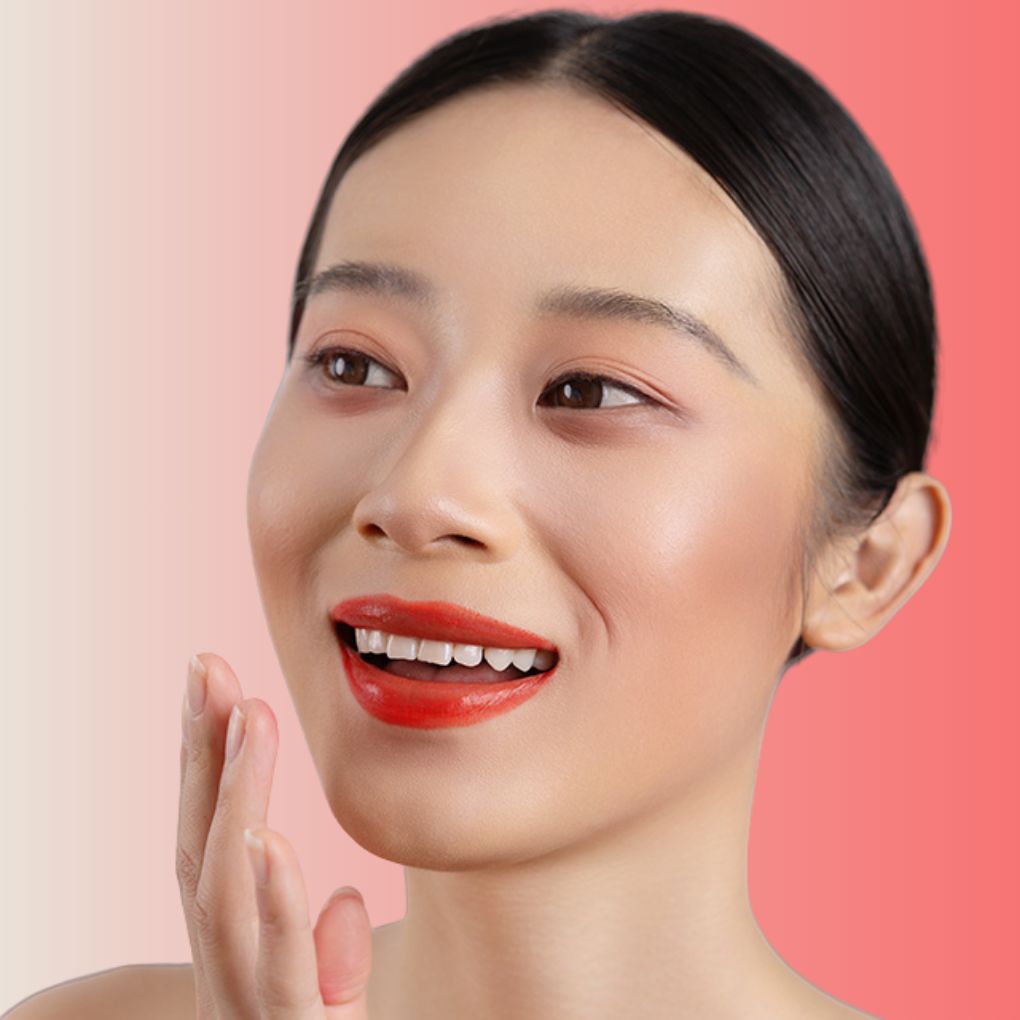 An elegant woman wearing the vegan, luxury and cruelty free oplenza Define & Refine Lip Liner in the color 25 Scarlet Flame