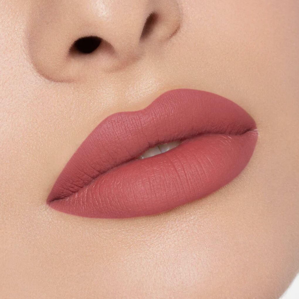 Close-up of a creamy, comfortable matte lipstick applied on lips in shade 01 First Impression