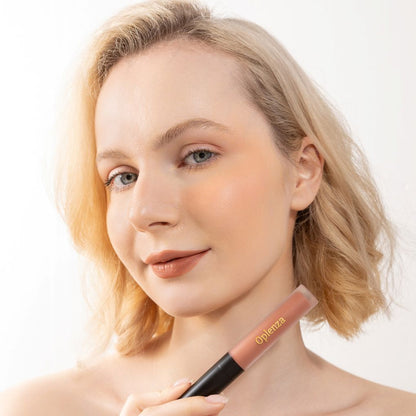 A Woman wearing and showcasing the elegant Oplenza Signature Velvet Liquid Lipstick in the color Silken Clay