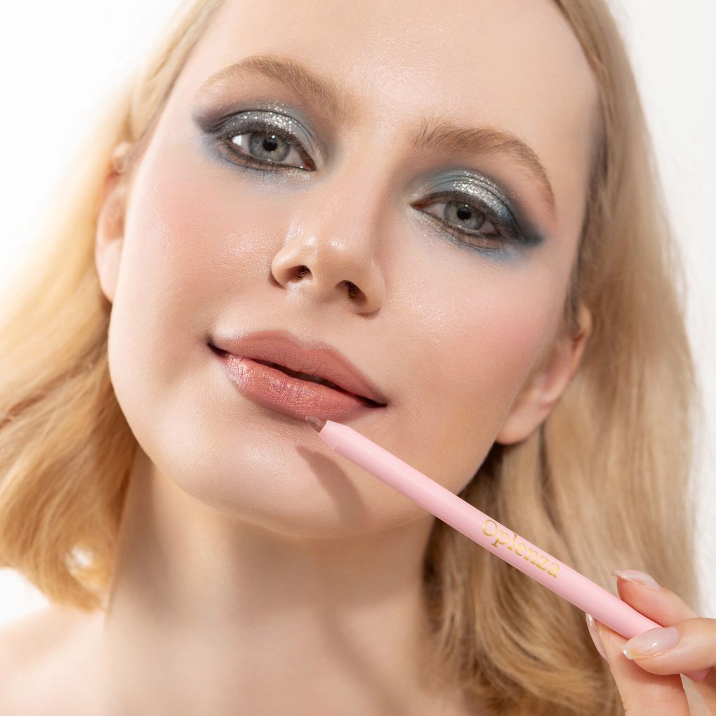 An elegant woman wearing and showcasing the vegan, luxury and cruelty free oplenza Define & Refine Lip Liner in the color Soft Taupe