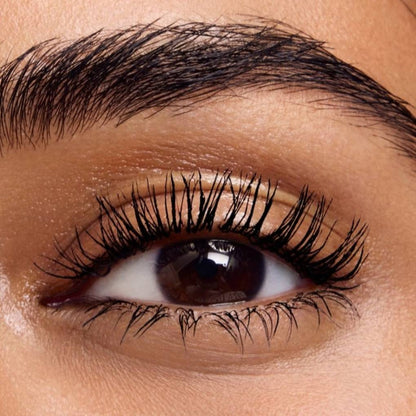 Close-up of an eye wearing and showcasing the effect of oplenza Ultra Definition Length & Volume Mascara on the eyelashes